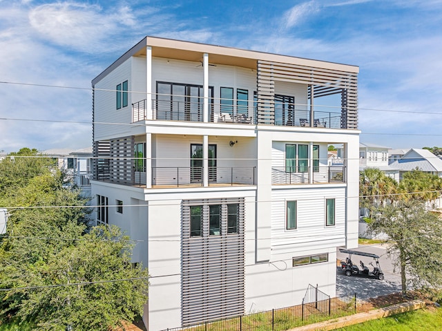 exterior space featuring a patio area and a balcony