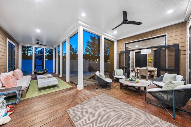 sunroom / solarium with wooden ceiling and a ceiling fan