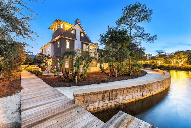 view of property exterior featuring a water view