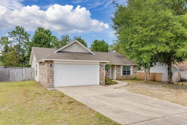 ranch-style house with a garage and a front lawn