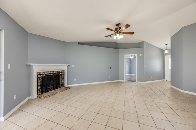 unfurnished living room featuring vaulted ceiling, light tile patterned floors, and ceiling fan