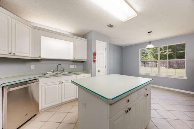 kitchen featuring sink, dishwasher, hanging light fixtures, white cabinets, and a center island