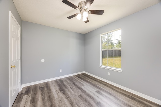 spare room with wood-type flooring, a textured ceiling, and ceiling fan