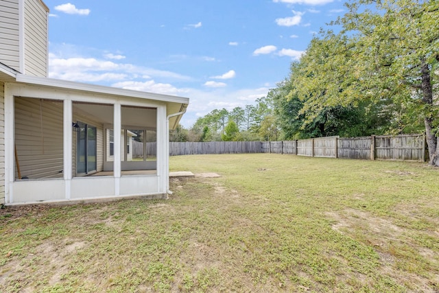 view of yard featuring a sunroom