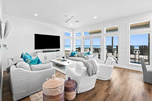 living room with ornamental molding, dark hardwood / wood-style flooring, and ceiling fan