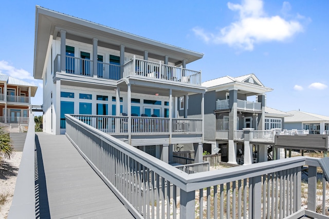 rear view of house featuring a balcony