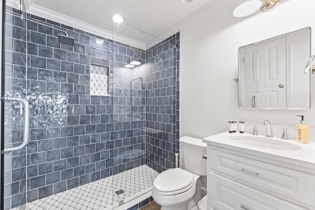 bathroom with crown molding, vanity, walk in shower, and toilet