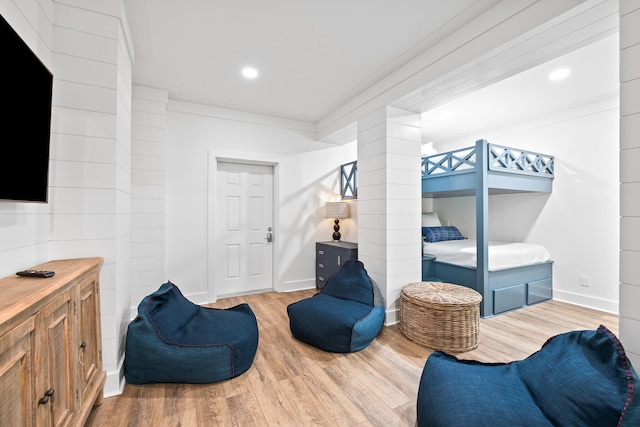 bedroom featuring crown molding and hardwood / wood-style floors