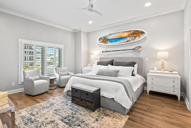 bedroom featuring ceiling fan, crown molding, and dark hardwood / wood-style flooring