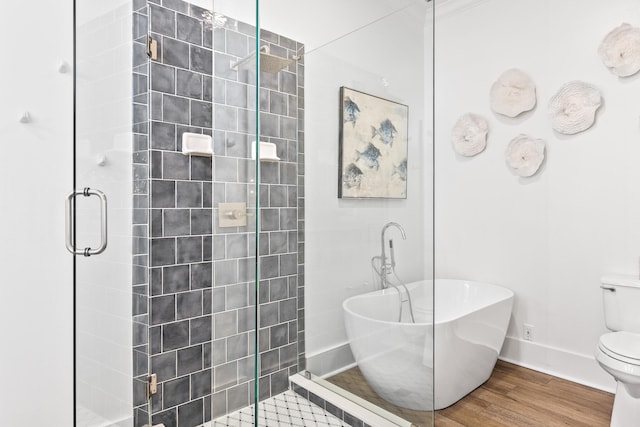 bathroom with independent shower and bath, hardwood / wood-style floors, and toilet