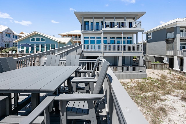 back of property featuring a balcony