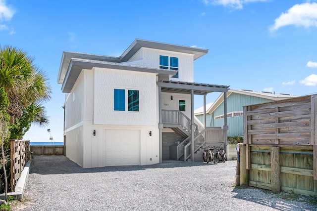 back of house with a garage