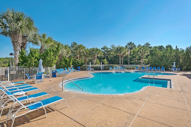 view of swimming pool with a patio