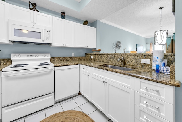 kitchen with white cabinetry, a textured ceiling, sink, and white appliances