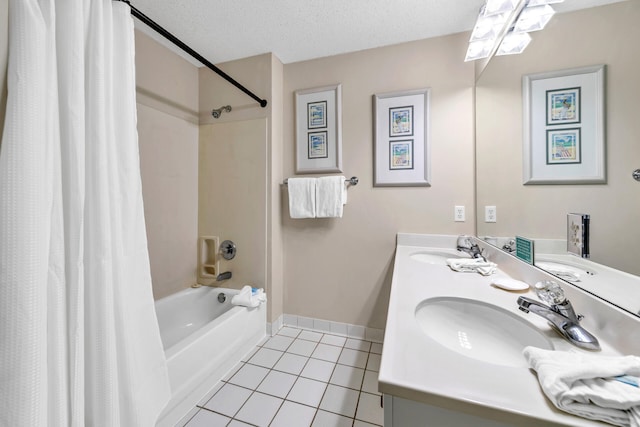 bathroom featuring vanity, tile patterned floors, a textured ceiling, and shower / bath combo