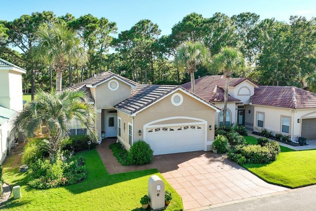 view of front facade featuring a front lawn and a garage