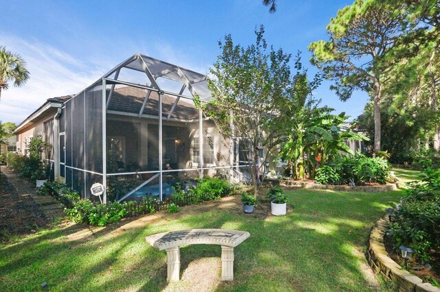 view of yard with glass enclosure