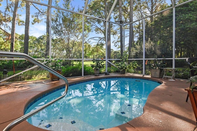 view of pool with a lanai and a patio area