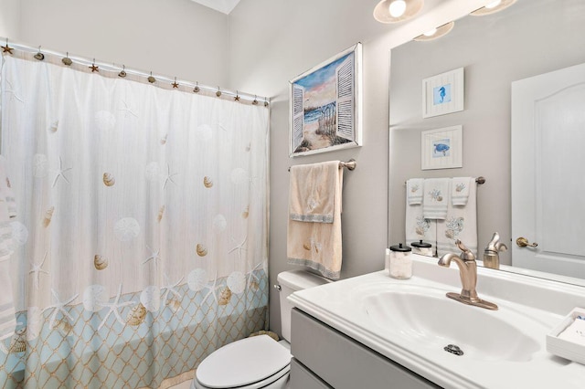 bathroom with vanity, toilet, and a shower with curtain