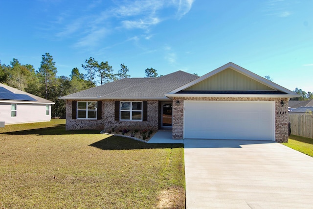 single story home featuring a front yard and a garage