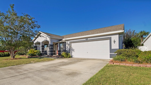 ranch-style house with a garage and a front yard