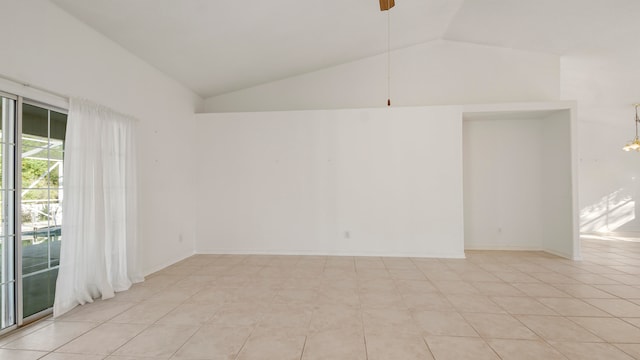 unfurnished room featuring lofted ceiling, light tile patterned floors, and ceiling fan