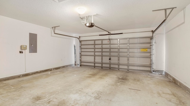 garage featuring a garage door opener and electric panel