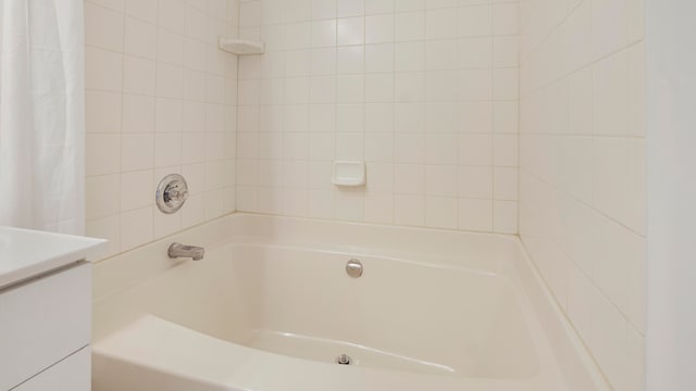 bathroom featuring shower / tub combo with curtain and vanity