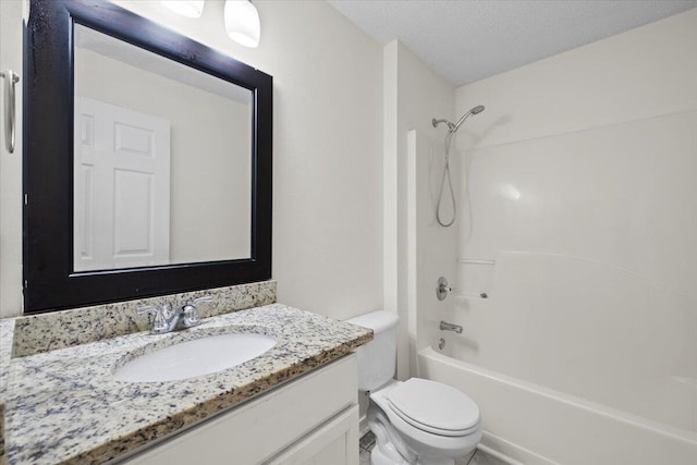 full bathroom featuring shower / bath combination, vanity, toilet, and a textured ceiling