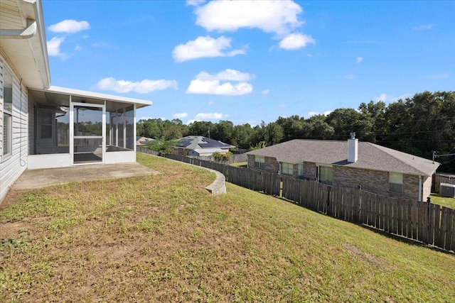 view of yard with a sunroom