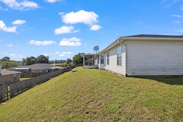 view of yard with a sunroom