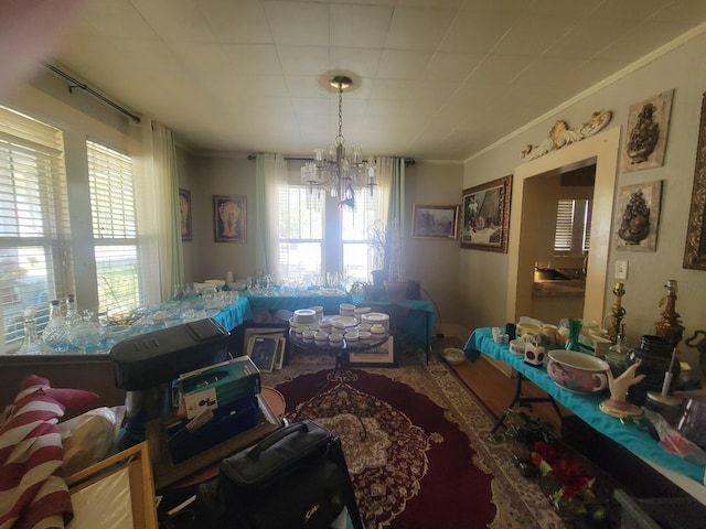 dining space featuring an inviting chandelier and crown molding