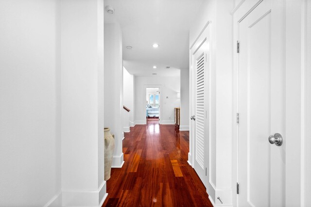 hall with hardwood / wood-style floors