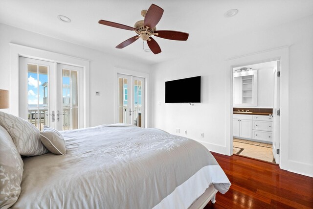 bedroom featuring multiple windows, french doors, hardwood / wood-style floors, and access to outside