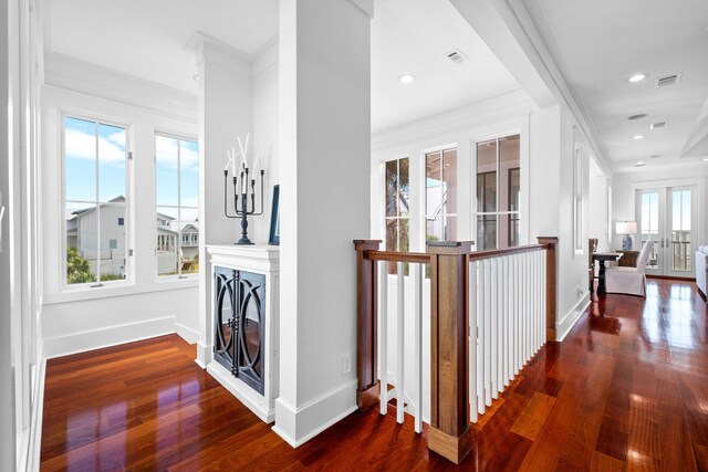 hallway featuring dark hardwood / wood-style flooring and a wealth of natural light