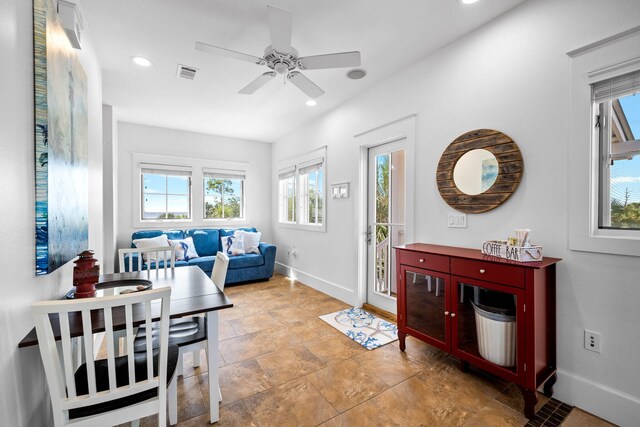 living room with plenty of natural light and ceiling fan