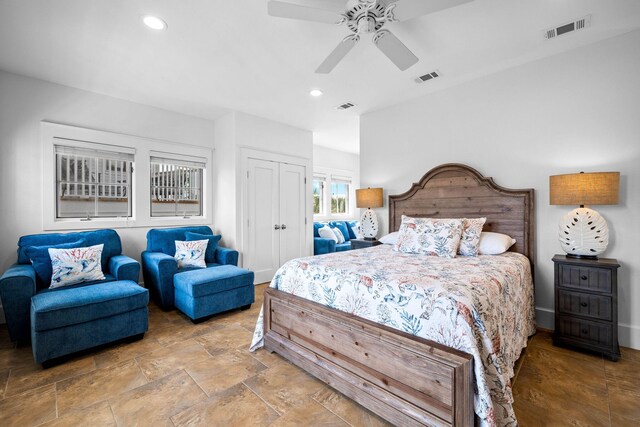 bedroom featuring ceiling fan and a closet