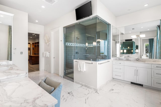 bathroom featuring vanity and an enclosed shower