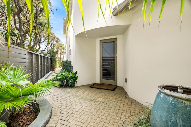 doorway to property with a patio area