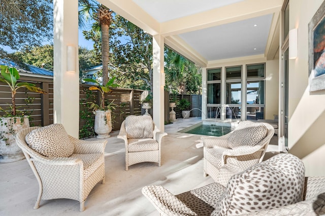 sunroom featuring a swimming pool