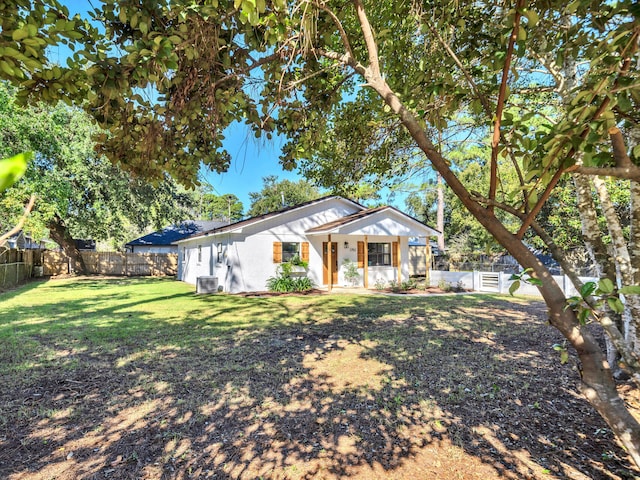 ranch-style home with a front yard and cooling unit