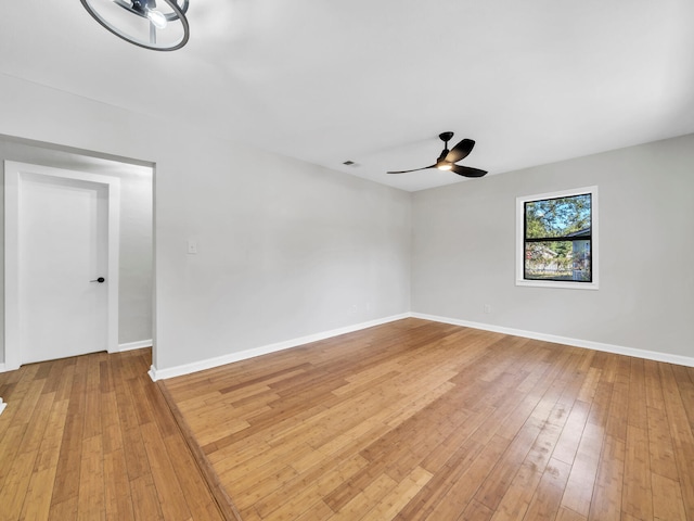 unfurnished room featuring hardwood / wood-style flooring and ceiling fan