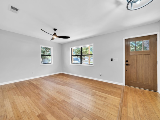 foyer entrance featuring ceiling fan, plenty of natural light, and light hardwood / wood-style floors