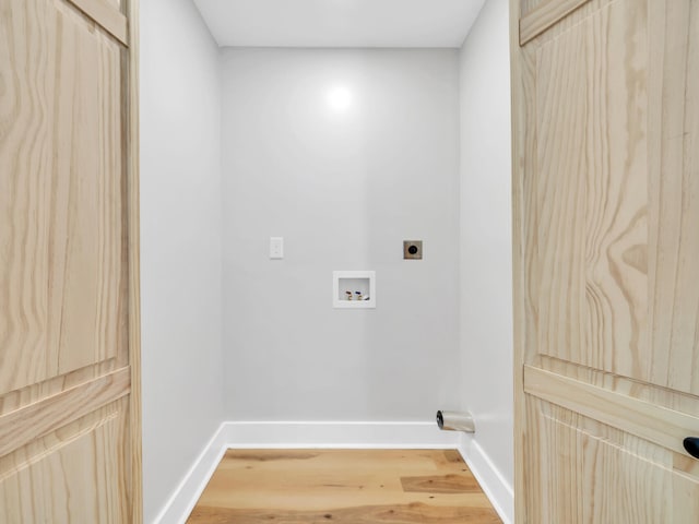 laundry area with wood-type flooring, hookup for a washing machine, and electric dryer hookup