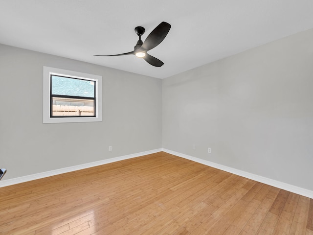 unfurnished room with ceiling fan and light hardwood / wood-style flooring