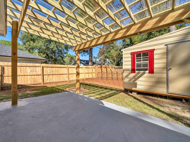 view of patio / terrace with an outbuilding and a pergola