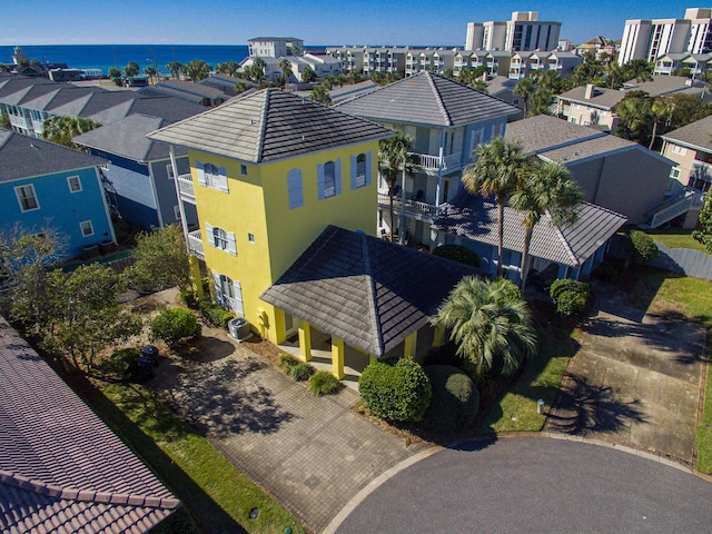birds eye view of property featuring a residential view and a water view