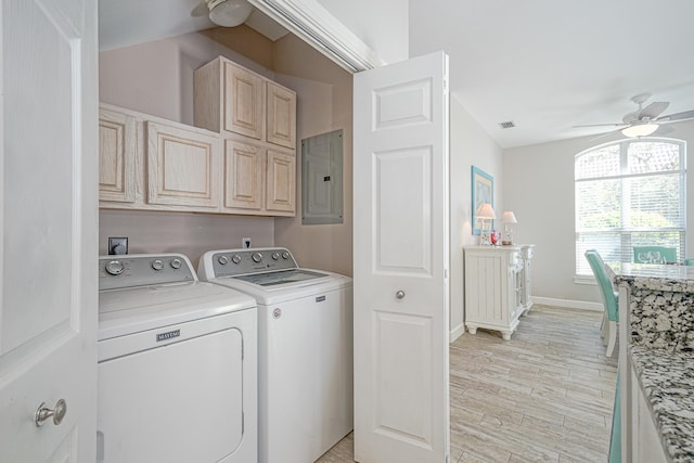 laundry room featuring electric panel, washer and clothes dryer, ceiling fan, light hardwood / wood-style floors, and cabinets