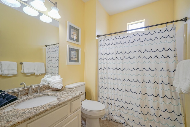 full bathroom with curtained shower, toilet, vanity, and tile patterned floors