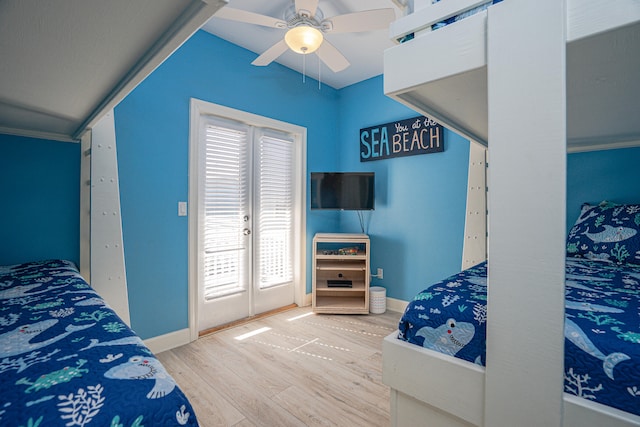 bedroom featuring french doors, crown molding, hardwood / wood-style flooring, and ceiling fan